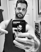 Starrfucker Coverboy, David Laflamme showing off his Starrfucker iPhone Case